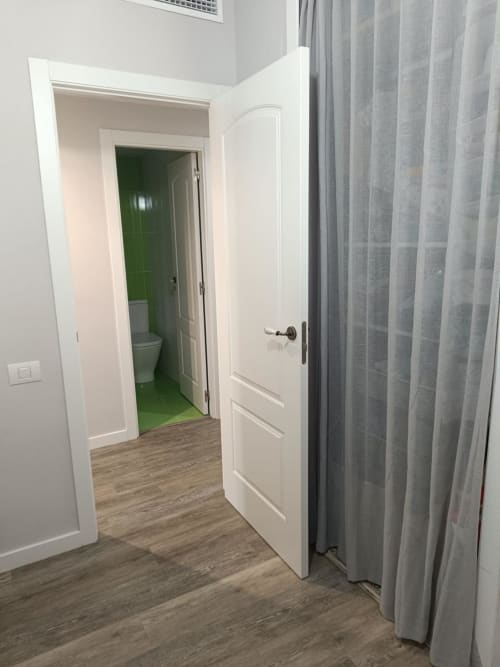 Hallway with white doors leading to bathroom in Riviera Sunny Flat apartment at Mediterranea Sunny Keys, Benicàssim