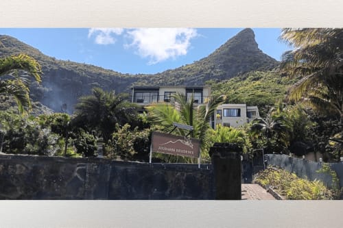 Joubarbe Résidence in Moka with mountain views, tropical gardens, and modern apartment nestled in lush hillside landscape
