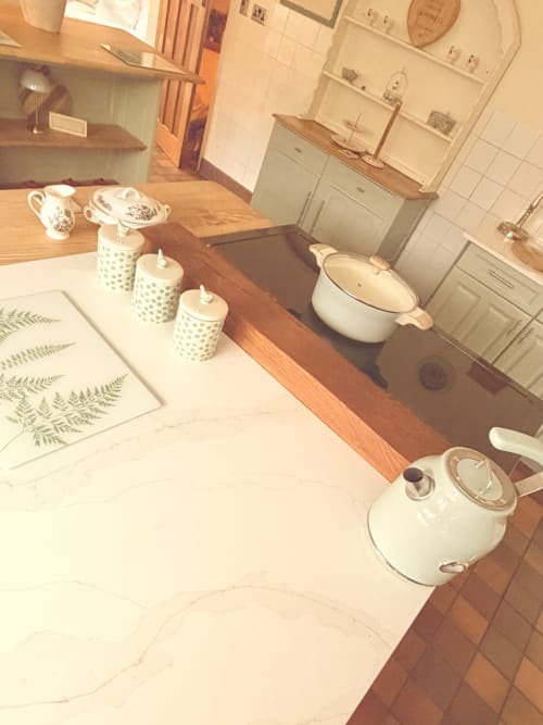 Luxury apartment kitchenette at The Usk Guest house, Brecon, with vintage tableware, ceramic canisters, and welcome tray