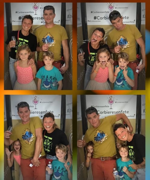 Family enjoying photo booth moments at Domaine Le Piboul wine event in Fontcouverte