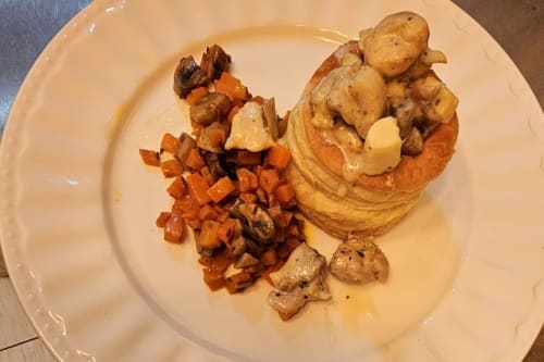 Elegant plated dish at Aux Prés Du Berry B&B featuring seared mushrooms, roasted root vegetables, and creamy puree in Chavin,
