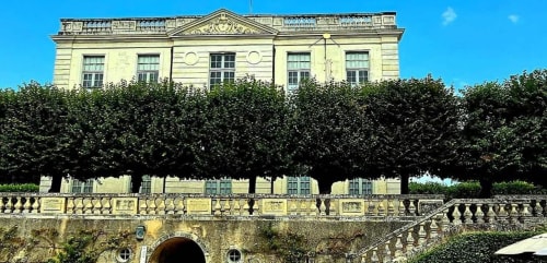 Aux Prés Du Berry B&B in Chavin, France: elegant neoclassical mansion with manicured hedges and blue sky