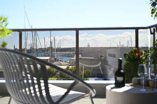 Balcony view of Bari marina with sailboats at Vimini Apulian Experience, featuring sea view from Conchiglia apartment