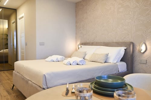Conchiglia apartment bedroom at Vimini Apulian Experience in Bari with sea view, modern decor and amenities