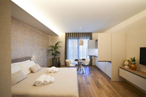 Conchiglia apartment at Vimini Apulian Experience in Bari with sea view, modern bedroom, living area and kitchen