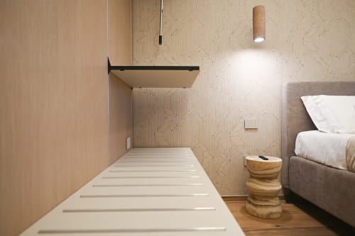 Modern bedroom at Vimini Apulian Experience in Bari with minimalist design, wooden accents, and sea view apartment setting