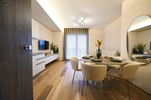 Levante apartment at Vimini Apulian Experience in Bari featuring modern kitchen, dining area with sea view, and elegant