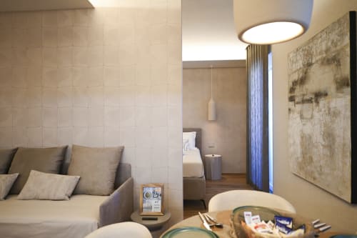 Ginestra apartment at Vimini Apulian Experience in Bari with modern living area, comfortable seating, and garden views