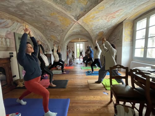 Yoga class in vaulted chapel at Roseto del Drago boutique hotel, Ponte In Valtellina, Italy