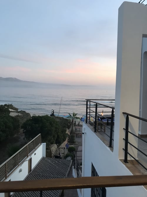 Sunset sea view from Tiguemi room balcony at Imsouane Surf Paradise hotel, Agadir, Morocco