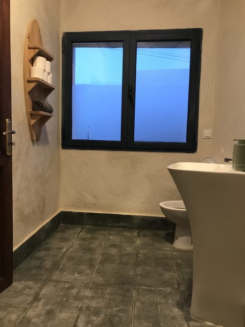 Modern bathroom with sea view at Imsouane Surf Paradise hotel in Agadir, Morocco featuring blue ocean vista through large