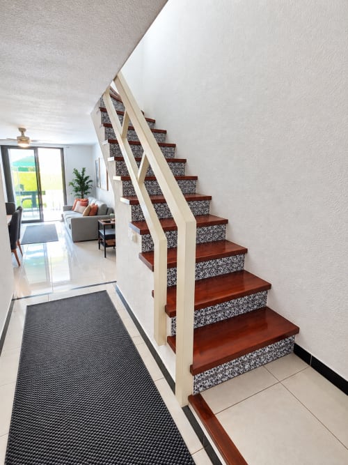 Modern staircase with wooden steps and patterned risers in Elegance Duplex apartment at Parque Santiago 2, Tenerife
