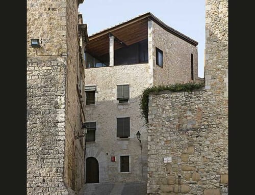 Stone cottage exterior at Alemanys 5 bed and breakfast in Girona, Spain with modern additions