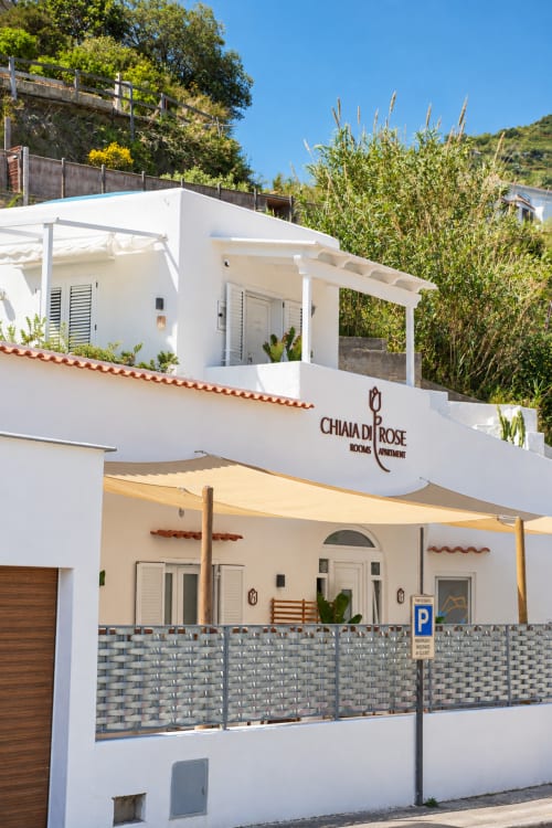 Chiaia di Rose rooms exterior in Serrara Fontana with white Mediterranean architecture, terrace, and parking