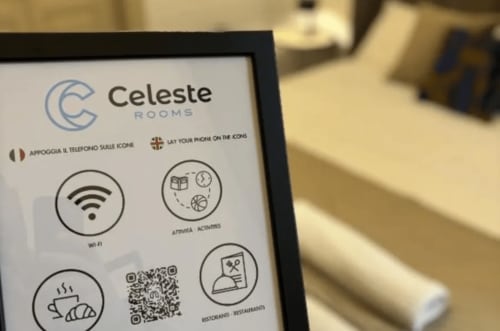 Celeste Rooms hotel information card displaying Wi-Fi, activities, breakfast, and restaurant amenities in Catania, Italy
