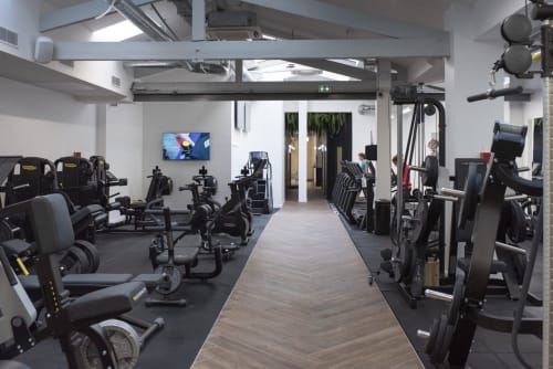 Modern gym with cardio and strength equipment at Résidence Aurmat Boutique Hotel, Boulogne-Billancourt Paris