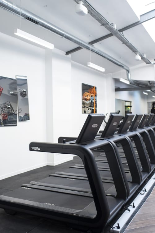 Modern gym with treadmills at Résidence Aurmat Boutique Hôtel in Boulogne-Billancourt, Paris