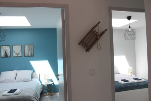 Résidence des Sables Toronto apartment hallway with blue bedroom and guest rooms at Mably hotel