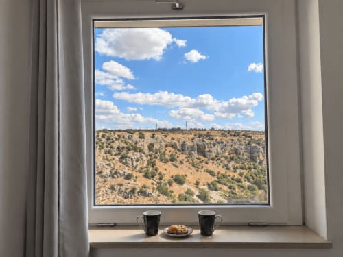 View of the Murgia Materana from the window of Deluxe Room Eva at Il Peccato Originale