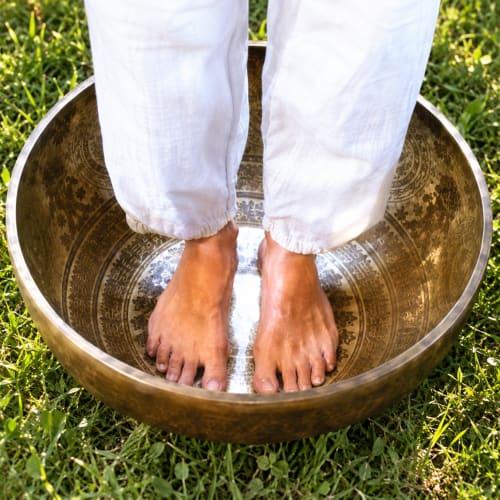 Feet soaking in ornate brass bowl at Jardin Sakina wellness spa in Marrakech