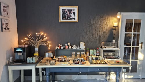 Breakfast buffet at Les Alisiers B&B in Nadrin, Houffalize featuring coffee maker, pastries, jams and morning refreshments