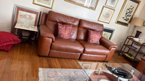 Brown leather reclining sofa with cushions in furnished 2-bedroom High Wycombe property living room