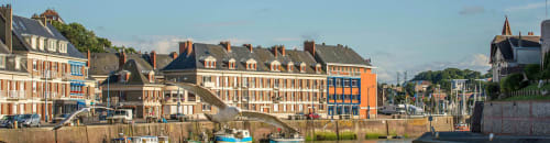 Colorful waterfront buildings in Saint-Valery-en-Caux with boats and harbor, Gites Saint Valery En Caux