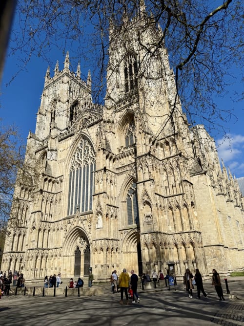 York Minster cathedral with visitors in the plaza, near Stonegate Townhouse hotel in York