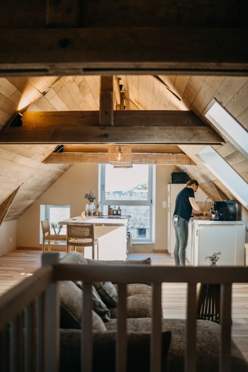 Cozy loft apartment at Le Clos d'Omaha with exposed beams, kitchenette, and mountain views