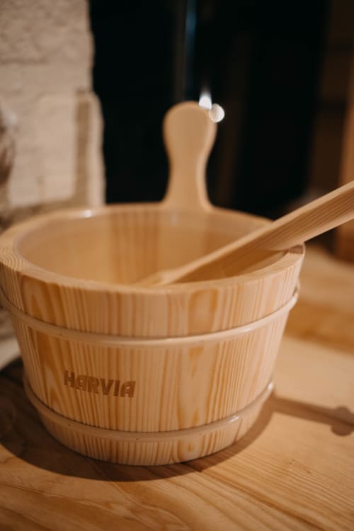 Wooden sauna bucket with ladle at Le Clos d'Omaha hotel in Normandy, France