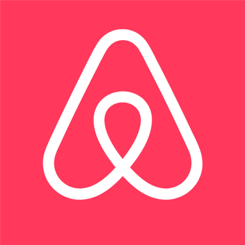 Logo Airbnb blanc sur fond rose corail pour la collection Blue Horizon à Saint-François
