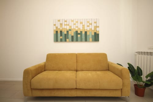 Modern mustard yellow sofa in bright living room with decorative wall art and potted plant at Palermo apartment