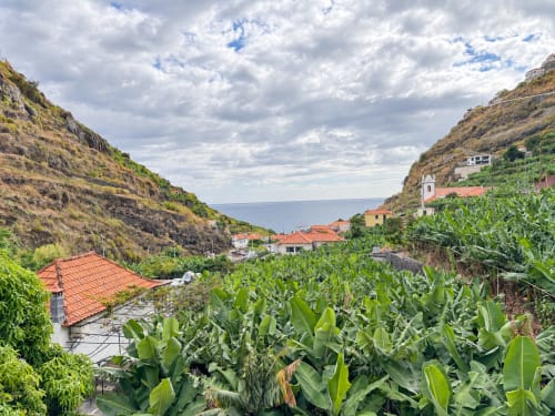 Ribeira Brava villa with sea view overlooking terracotta-roofed houses, banana plantations, and coastal cliffs