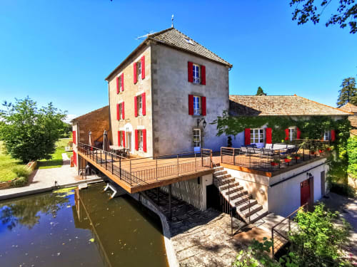 Le Moulin des Ducs cottage in Epinac with river view, red shutters, wooden decks and terraces