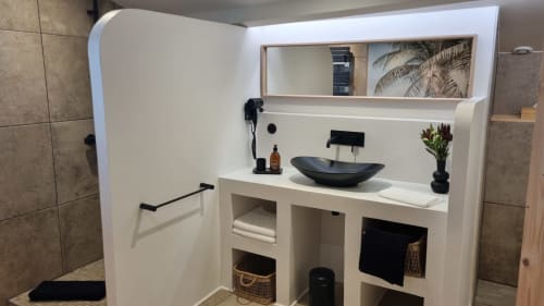 Modern bathroom vanity with black vessel sink at La Villa Tonga, Fronsac