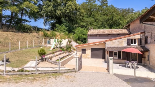 Domaine De Pimpine countryside property in Galgon with stone buildings, terrace, and landscaped grounds