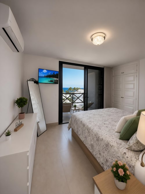 Luxury penthouse bedroom with sea view balcony in Playa de las Américas, Tenerife