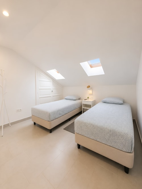 Modern twin bedroom with skylight windows in Luxury Penthouse, Playa de las Américas Tenerife