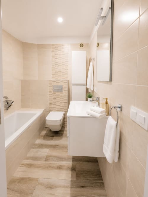 Modern bathroom in Luxury Penthouse Parque Santiago I, Playa de las Américas, featuring beige tiles, white fixtures, and