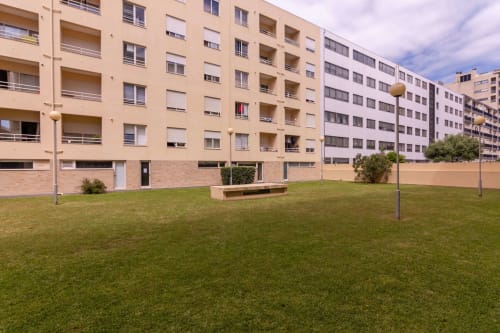 EcoHost apartment complex in Matosinhos with green courtyard, modern residential buildings, and beachfront access