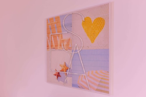 Colorful modern wall art with yellow heart, orange geometric patterns, and neon pink line sculpture in EcoHost apartment