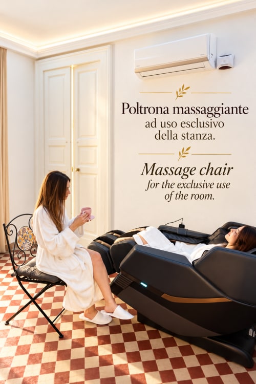 Kobieta w szlafroku korzystająca z fotela do masażu w eleganckim pokoju B&B w Katanii z klimatyzacją i nowoczesnymi udogodnieniami