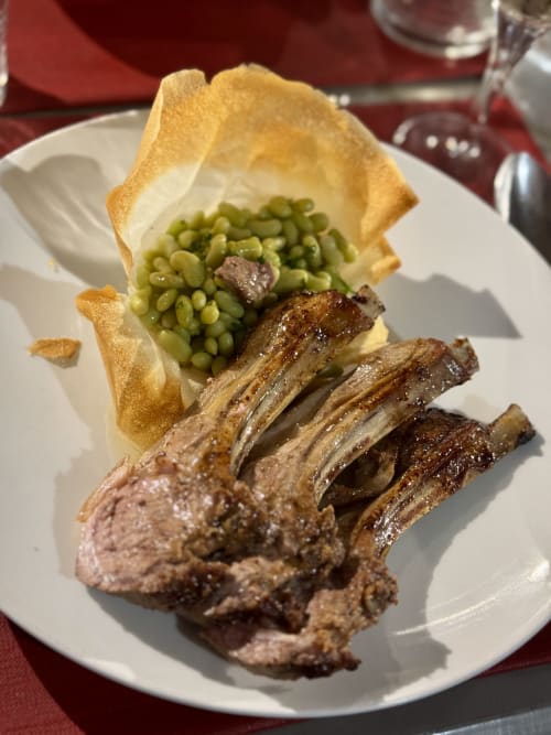 Gourmet lamb chops with peas and crispy potato basket at Les Vieilles Digues, Beauvoir