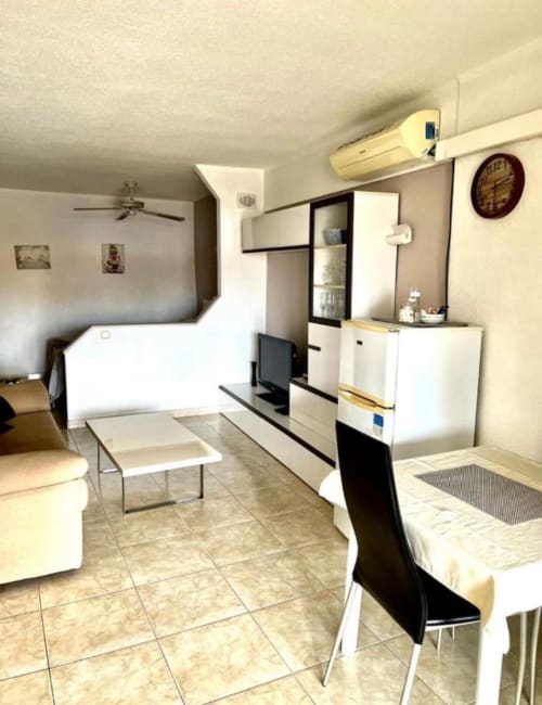 Modern studio apartment in Costa Adeje, Tenerife with living area, kitchenette, bed, dining table, air conditioning and pool