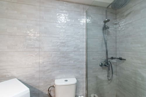 Modern bathroom in Sunny Studio apartment, Costa Adeje, Tenerife, featuring tile shower enclosure with rainfall showerhead