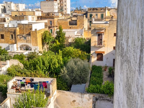 Aerial view of lush garden courtyard at HABITARE Lecce with traditional Salento architecture and greenery