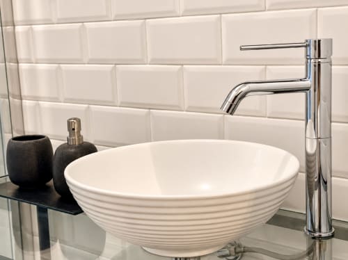 Modern bathroom sink with white ceramic bowl and chrome faucet at HABITARE Lecce boutique hotel in Salento, Italy
