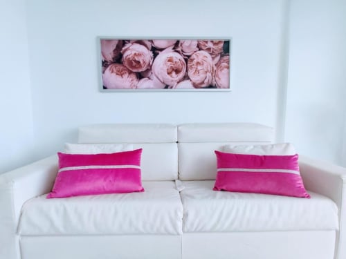 Modern apartment living room at Manage Home Tenerife with white sofa, pink pillows, and floral artwork in Costa Adeje