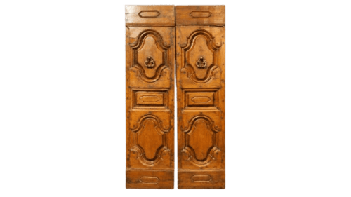 Ornate wooden cabinet doors with carved decorative panels at Casa Rural Garden Suites in Xàtiva