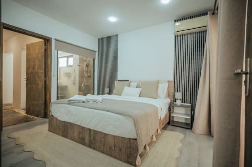 Spacious master bedroom at Gerards & Angel villa in Pereybere with king bed, ensuite bathroom, and modern furnishings